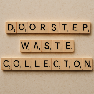 Arrangement of wooden letter tiles spelling trash on a wooden table surface.